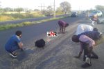 Nkulumane residents help themselves to wheat after truck mishap Thabitha Khumalo, who is also a Member of Parliament for Bulawayo Metropolitan look on his residents help themselves to the wheat