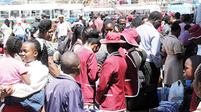 Pupils from various boarding schools wait for transport back to school at the Large City Hall car park in this file photo