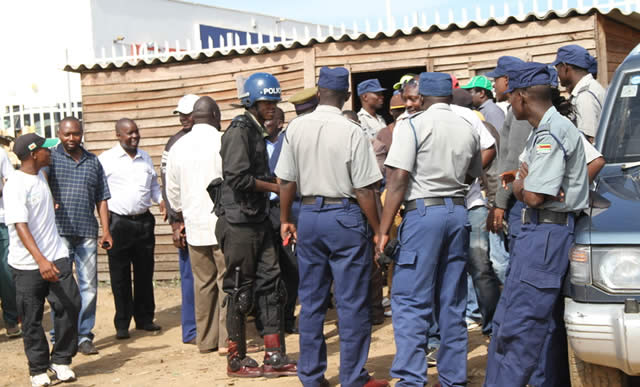 File picture from February 2015 of police waiting outside Glen View 8 Complex management office to enforce order after some disturbances.