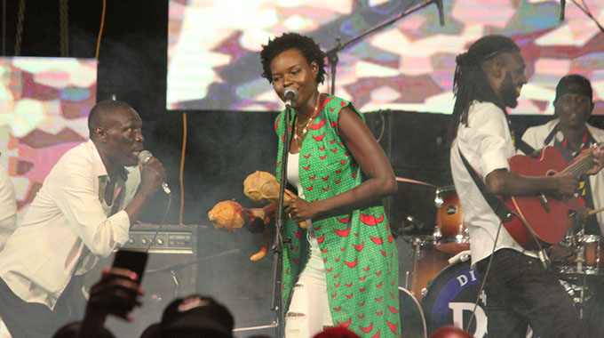 Selmor Mtukudzi (centre) shares the stage with her husband Tendai Manatsa (right)