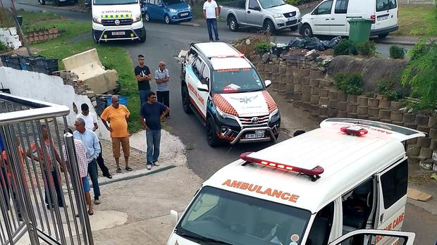 Emergency services and members of the Chatsworth community at the home a pensioner who was killed during a violent home invasion on Tuesday. Picture: Rescue Care Paramedics