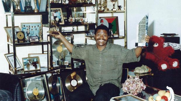 Joseph Shabalala poses with his Grammy and OKTV awards. File photo: Morris Reddy/ Independent Archives