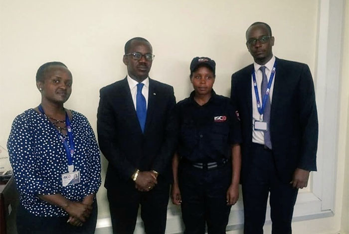 Rwanda’s minister in charge of legal affairs Evode Uwizeyimana has resigned after pushing a female security guard to the ground. The minister later visited the security guard at her employer's office. She is pictured second-right below.