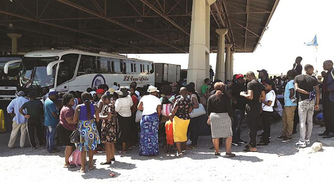 Travellers await clearance on the Zimbabwean side at Beitbridge Border Post