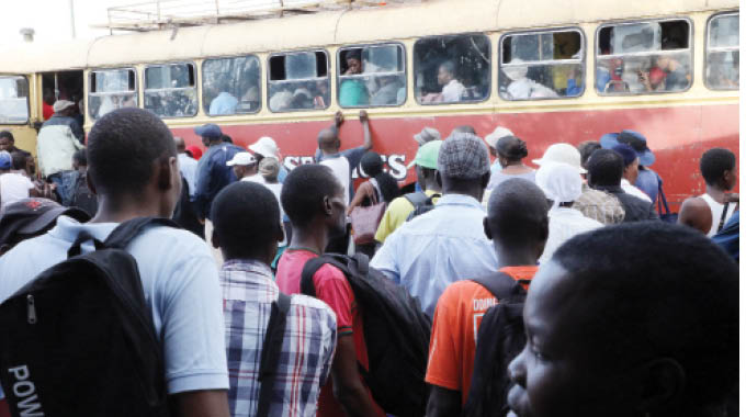 Commuters crowd into a Zupco bus in Bulawayo yesterday