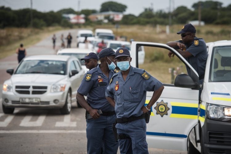 Members of the Police force can be seen blocking the R101 as they await the 146 repatriated South Africans from Wuhan after they arrived at the Polokwane Airport before being transported to the quarantine zone at The Ranch Resort, 14 March 2020, Polokwane. (Picture: Jacques Nelles for Citizen)