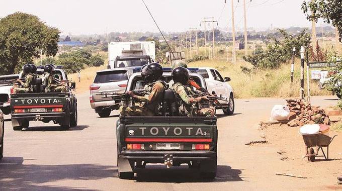 President Emmerson Mnangagwa’s motorcade drives through Kamunhu Shopping Centre in Mabvuku, Harare, where he was assessing the public’s lockdown compliance in April 2020. — Picture: Tawanda Mudimu