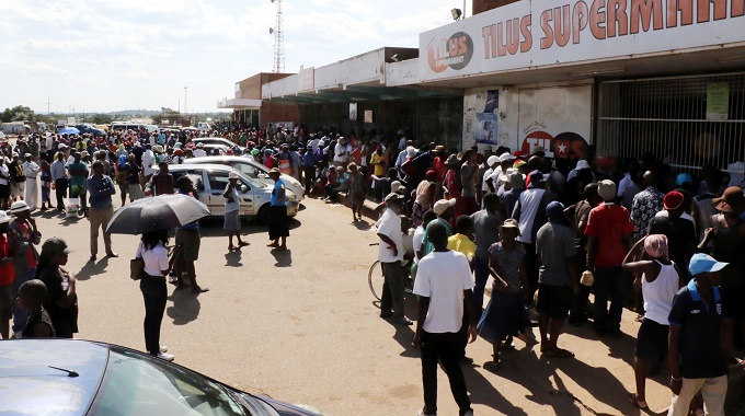 There was pushing and shoving at a long winding queue for mealie meal at Nketa shopping Centre yesterday.