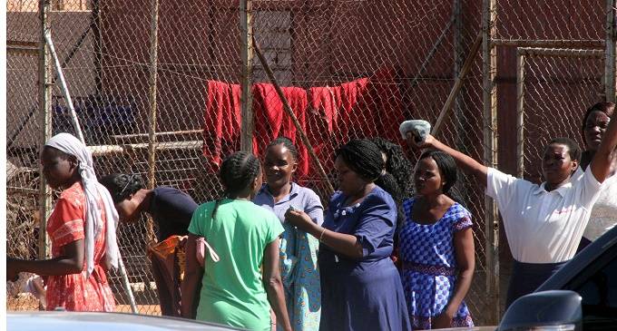 Members of the Revival of Jesus Miracles Ministries inside the detention cage at Tshabalala Police Station after they were arrested for violating the lockdown at their church in Bulawayo yesterday (Picture by Nkosizile Ndlovu)