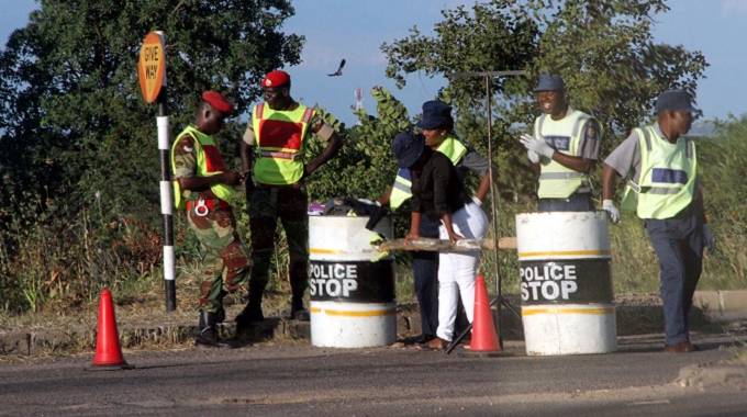 Police officers and Zimbabwe National Army personnel man a roadblock along Khami Road in Bulawayo yesterday. (Picture by Nkosizile Ndlovu)