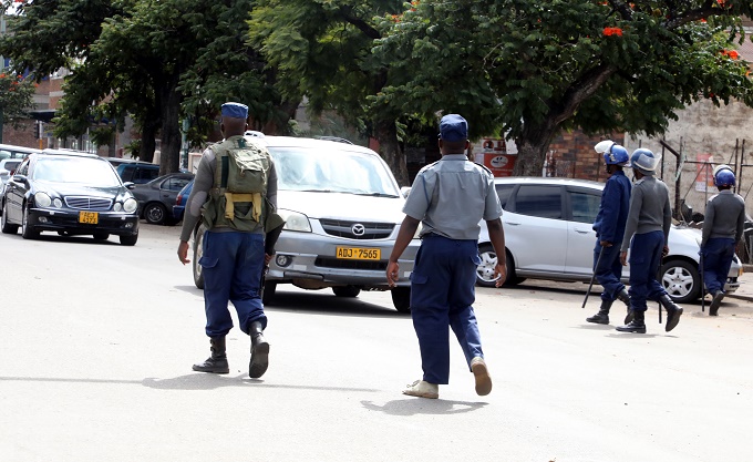 Police patrol the Bulawayo central business district yesterday.