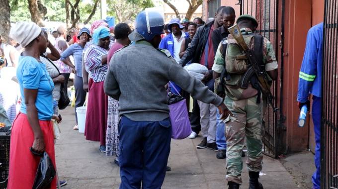 Security forces maintain order at a vegetable market in Bulawayo yesterday