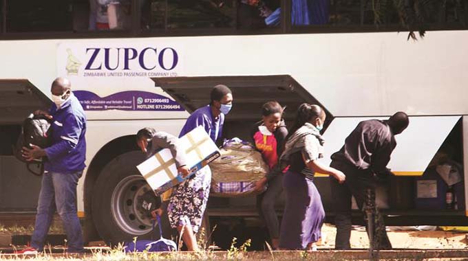 Returning residents from South Africa offload their luggage at Harare Polytechnic College where they will be quarantined for 21 days in line with Covid-19 requirements in Harare yesterday. — Picture: Innocent Makawa