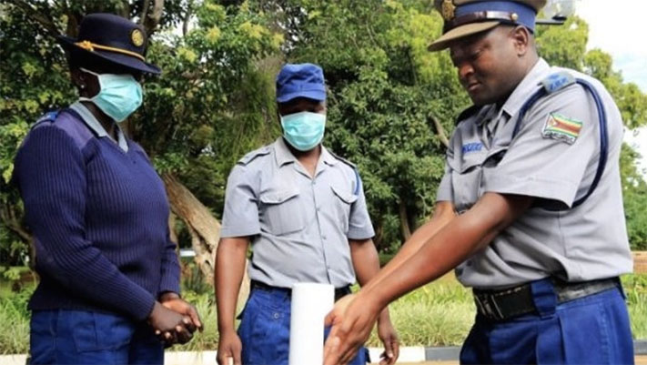 Police in Zimbabwe wearing face masks