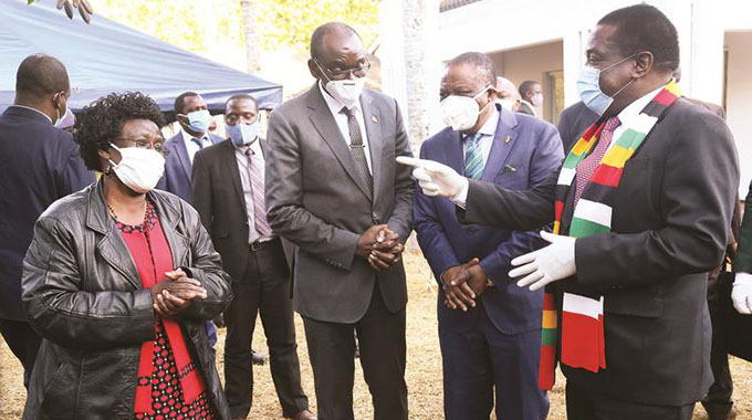 President Mnangagwa speaks to the late Cde Perrance Shiri’s sister, Eusebia Chifamba when he consoled the national hero’s family in Borrowdale, Harare, yesterday in the company of Vice Presidents Constantino Chiwenga (second from right) and Kembo Mohadi. — Picture: Believe Nyakudjara