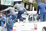 Rowdy mob holds police officers hostage Police officers leap into action to round up some vendors who were still operating after the 3PM Covid-19 regulations to close shop in the Bulawayo city centre