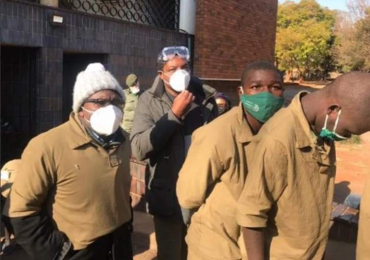 Transform Zimbabwe leader Jacob Ngarivhume (left) seen here with journalist Hopewell Chin'ono (centre)