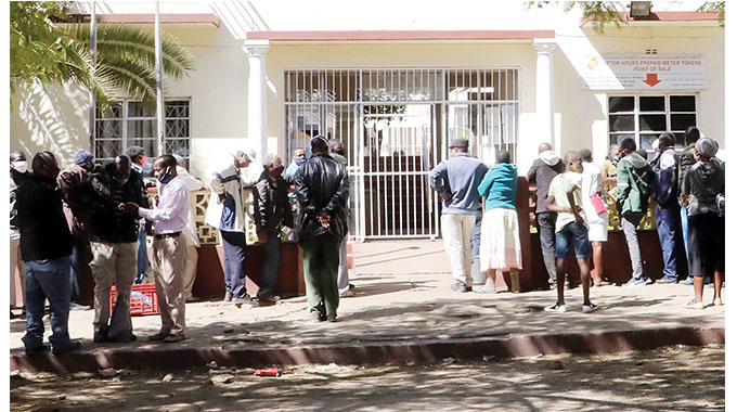 Customers queue to buy prepaid electricity tokens in Bulawayo yesterday