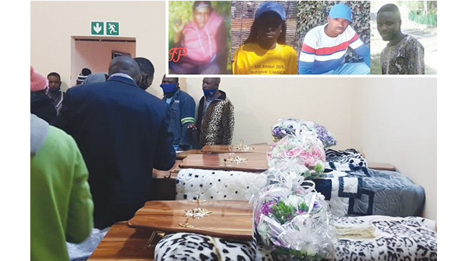 Family and friends pay their last respects to the late four family members in South Africa
