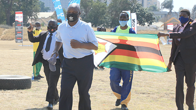 WELL DONE WARRIOR . . . Legendary Zimbabwean coach, Sunday Chidzambwa, bursts into a sprint as he completes his 5km fund-raising walk at Raylton Sports Club yesterday