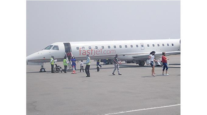 Passengers disembark from Fastjet ERJ145 in Victoria Falls yesterday
