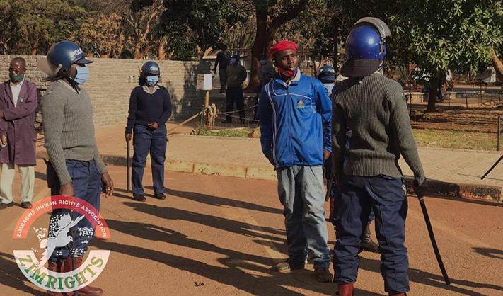 MDC Alliance activist Terrence Manjengwa stands up to riot police in Harare