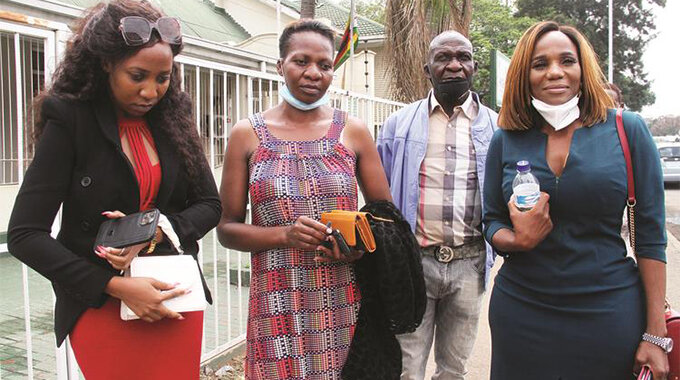 The late Genius “Ginimbi” Kadungure’s former wife Zodwa Mkandla (right) and Kadungure family members, who included the deceased businessman’s father Mr Anderson Kadungure (second from right)and sisters Nelia (in red dress) and Juliet, leave the offices of the Master of the High Court in Harare yesterday. — Picture: Kudakwashe Hunda