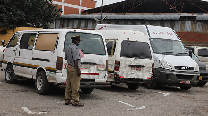 Harare provincial police spokesperson Simon Chazovachii shows some of the impounded cars at Harare Central Police Station for not following covid 19 restrictions in Harare yesterday. Picture : Justin Mutenda
