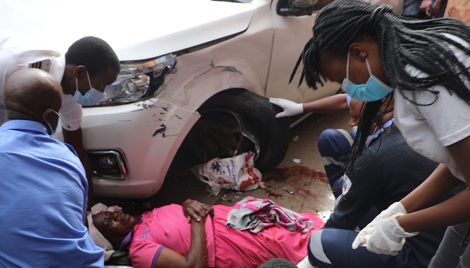 Medical Staff help the injured after an accident in which a Nissan Navara veered off the road and rammed onto the former Post Office building along Leopold Takawira Avenue yesterday…Pic By Dennis Mudzamiri…