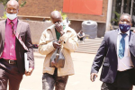 Interpol engaged to hunt for child kidnapper Detectives escort Gift Chemhuru as he appears at the Harare Magistrates Courts in connection with the kidnapping of a 4-week-old baby at Spar Montague recently. — Picture: Lee Maidza
