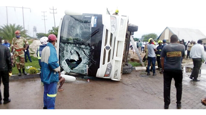 About 30 people were rushed to Mpilo Central Hospital after a Zupco bus overturned at Petro Trade filling station in Matshobana, Bulawayo yesterday. According to witnesses, the bus which was headed for the city centre swerved off the main road and overturned due to a combination of high speed and slippery conditions caused by the rains. The incident happened at around 5PM. (Picture by Innocent Kurira)
