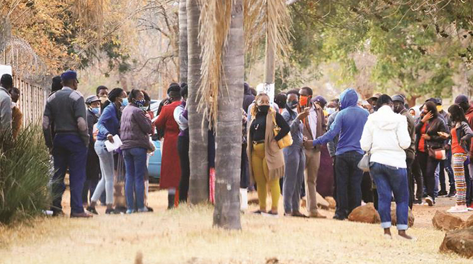 Part of a large crowd gathered at a Borrowdale, Harare, premise in August 2020 to engage in pyramid scheme activities before they were rounded up by the police for violating lockdown regulations
