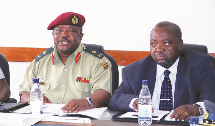 FILE picture of Major General Douglas Nyikayaramba expressing a point before the Parliamentary Portfolio Committee on Defence and Security. Looking on is Ministry of Defence Permanent Secretary Mr Martin Rushwaya. — (Picture by John Manzongo)