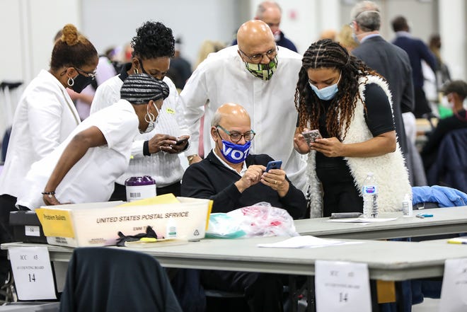 Detroit election workers count absentee ballots at TCF Center on November 4, 2020