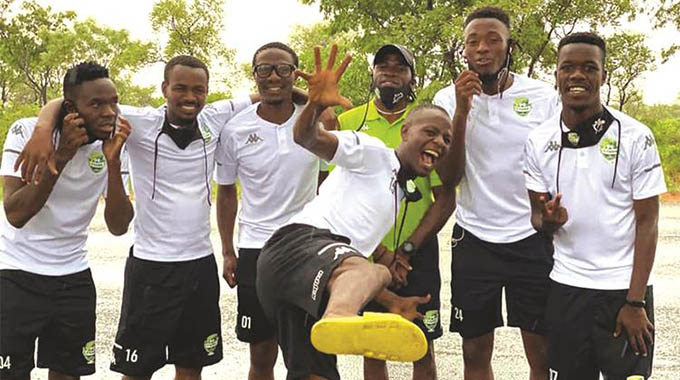THE HAPPY PEOPLE. . . FC Platinum players and their goalkeepers’ coach, Tembo Chuma, are celebrating their team’s victory in the first leg of their Champions League preliminary round tie against Costa do Sol of Mozambique