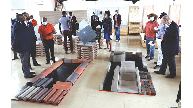 Invited guests are taken on a tour of the new PG Centre branch showroom in Belmont, Bulawayo