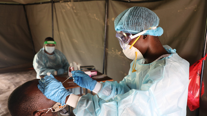 Mutare City Council Health Department and the Ministry of Health and Child Care staffers busy at work screening and testing residents for Covid-19 at Sakubva Beit Hall on Wednesday. —Picture: Tinai Nyadzayo.