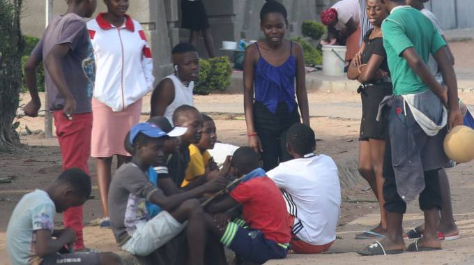 A group of young ones gather without masks and social distancing at Mpopoma suburb