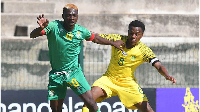 Lexington Mujokoro (left) in action against South Africa