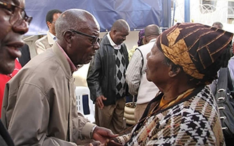 FILE picture of Morton Malianga being consoled by Mrs Rubbie Mwayera at Nyaradzo Funeral Parlour in June 2014 following the death of his brother, nationalist Washington Malianga. — (Picture by Tawanda Mudimu)