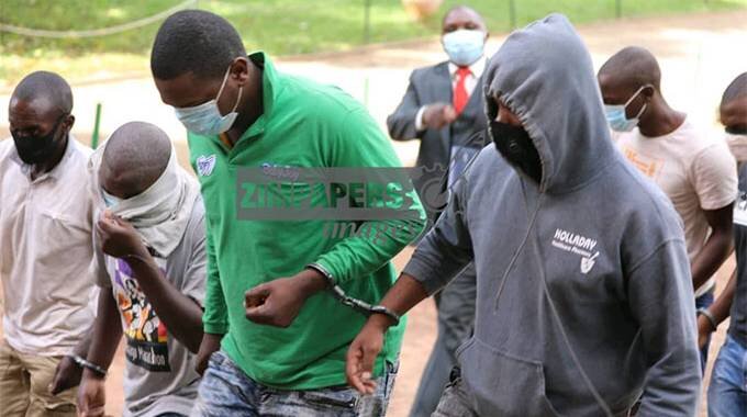 EIGHT suspected armed robbers, believed to be behind the Harare-Chinhoyi road US$2.7million heist, appeared in court today.