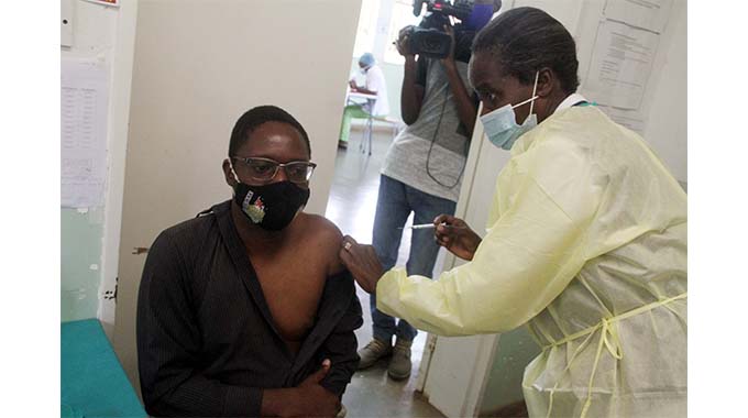 Chronicle Reporter Nqobile Tshili receives a Covid-19 jab at North End Clinic yesterday