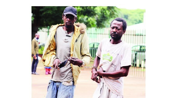 Murder suspects Kervin Dendera and Arnold Shoriwa appear at Harare Magistrate Courts yesterday. — Picture: Lee Maidza