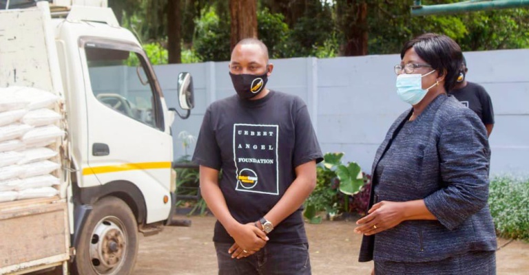 Angel of Hope Foundation board chairperson Mrs Molly Dingani (right) receives a donation of maize meal on behalf of First Lady Auxillia Mnangagwa from Uebert Angel Foundation representative Pastor Felix Chikasa at Zimbabwe House