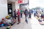 Gweru money changers, vendors continue to violate lockdown regulations Vendors and money changers waiting for clients outside OK Supermarket in Gweru yesterday