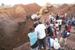 Three die in flooded mine shaft This file picture shows villagers watching as a Zimgold Fields excavator works on retrieving illegal gold miners that are suspected to have been buried alive in a mine shaft at Premier Estate in Mutasa, Manicaland, . — Picture: Tinai Nyadzayo