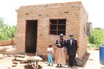 Plumtree arson victims’ first room complete Mr Lewis Phiri and his wife Mrs Esnath Phiri in front of the almost complete room of their house under construction