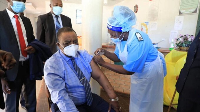 Vice President Constantino Chiwenga receives his second jab of Sinopharm vaccine from Sister Thandiwe Mpofu at Wilkins Clinic