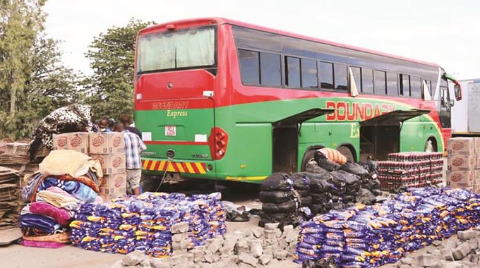 Some of the 22 buses intercepted at police checkpoints on roads leading to Harare and Bulawayo from Beitbridge. According to border officials, the buses were carrying an assortment of smuggled goods. — Pictures: Thupeyo Muleya