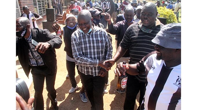 New Highlanders chairman Johnfat Sibanda is congratulated by some of the members that turned out for the elections